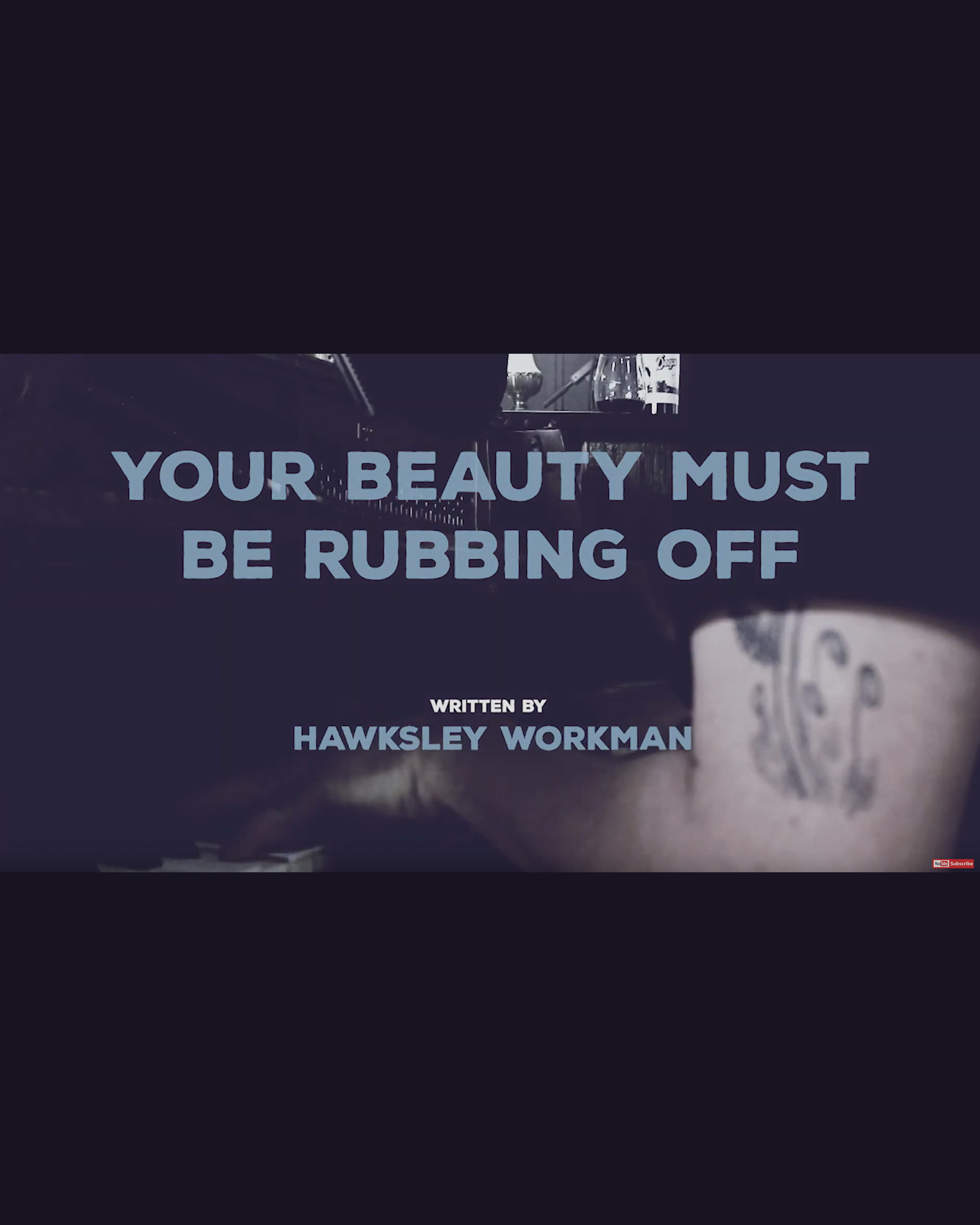 Screenshot of the video Your Beauty Must Be Rubbing Off on Me featuring the titles and the arm of Deeps at the piano