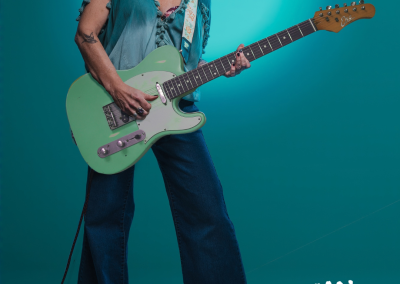 woman singing with guitar while standing up