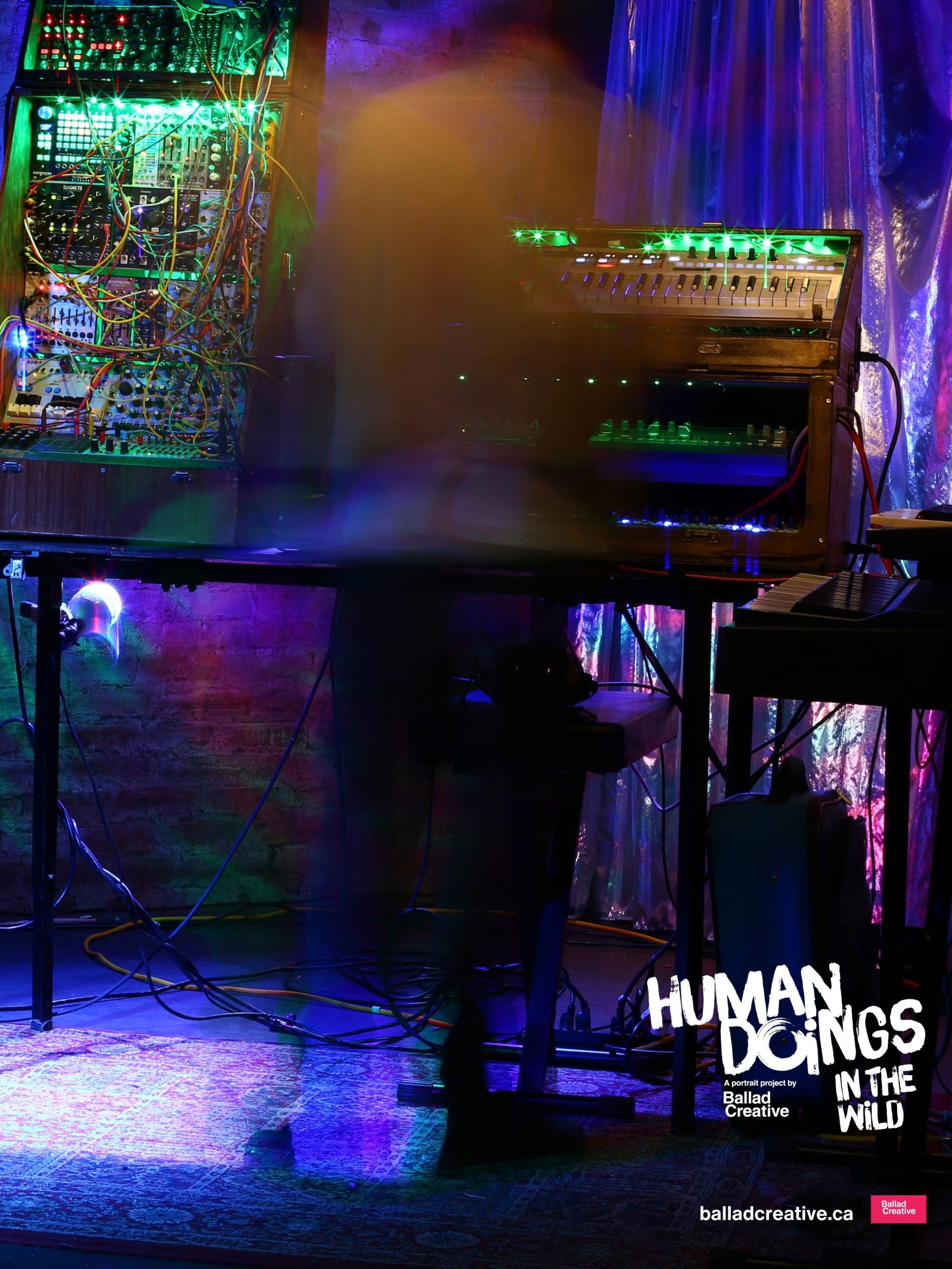 blurred image of Current Fantasy performing with analog synth set up